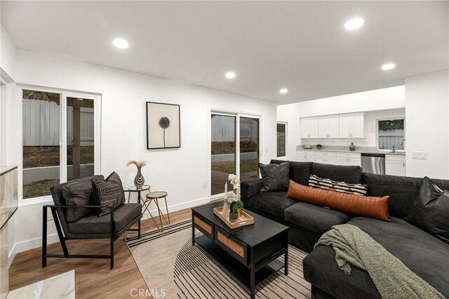 12573 Brickellia St, San Diego, CA 92129 - living room featuring french doors, light wood finished floors, recessed lighting, and baseboards
