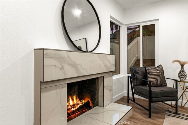 12573 Brickellia St, San Diego, CA 92129 - living area with wood finished floors, stairs, and a fireplace