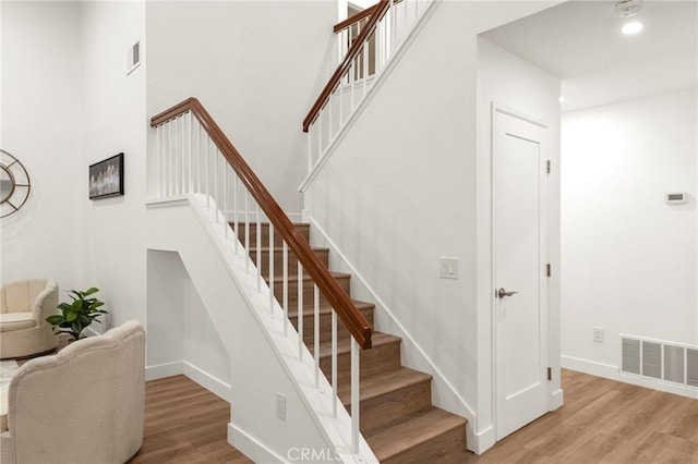 12573 Brickellia St, San Diego, CA 92129 - stairway with wood finished floors and baseboards