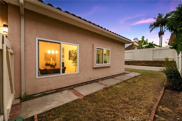 12573 Brickellia St, San Diego, CA 92129 - property exterior at dusk with stucco siding
