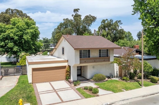 25263 Via Sistine, Valencia, CA 91355 - view of front of home featuring stucco siding, driveway, and a garage