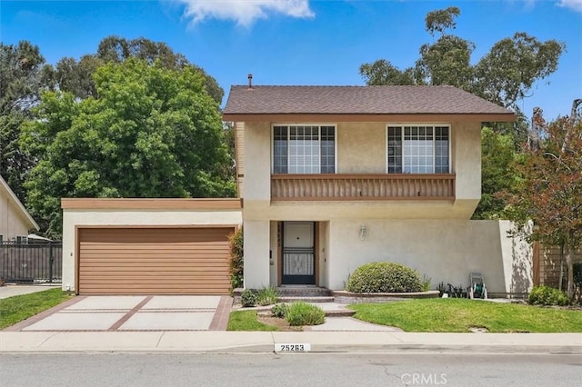 25263 Via Sistine, Valencia, CA 91355 - view of front facade with stucco siding, an attached garage, and concrete driveway