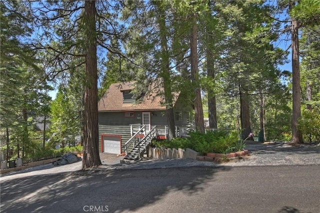 535 Pioneer Rd, Lake Arrowhead, CA 92352 - view of front facade featuring driveway, a garage, and stairs