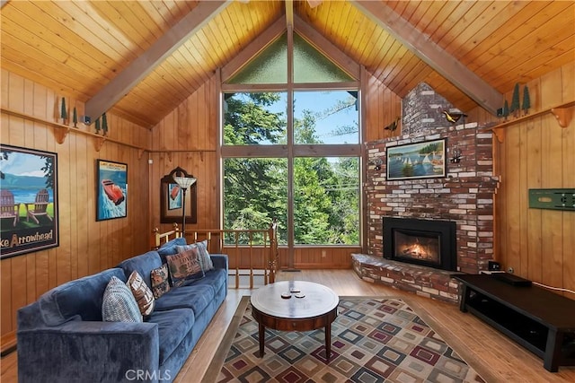 535 Pioneer Rd, Lake Arrowhead, CA 92352 - living room featuring wooden walls, wood finished floors, a brick fireplace, and wood ceiling