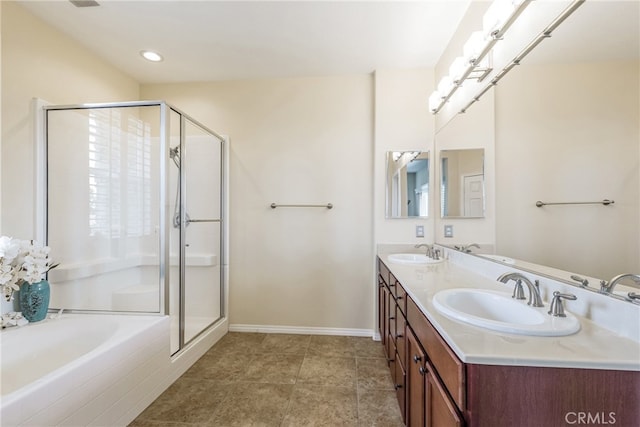 28426 Herrera St, Valencia, CA 91354 - bathroom with double vanity, a bath, a shower stall, and baseboards