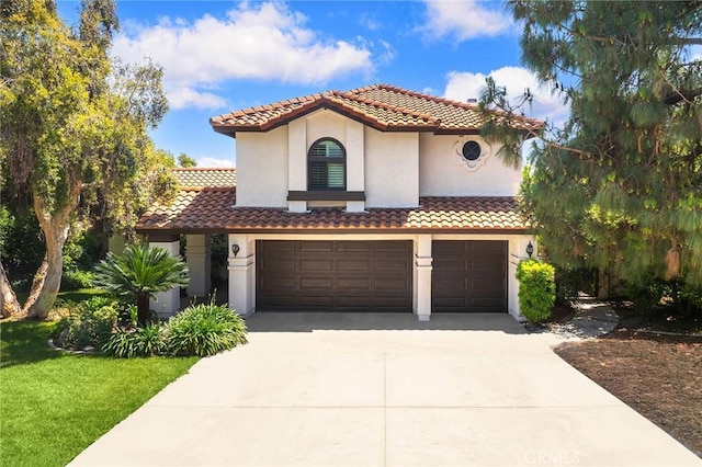 8093 Banyan St, Rancho Cucamonga, CA 91701 - mediterranean / spanish-style house featuring concrete driveway, stucco siding, an attached garage, and a tiled roof