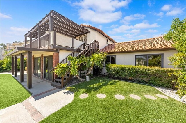 8093 Banyan St, Rancho Cucamonga, CA 91701 - back of house with a pergola, a lawn, stucco siding, and a tiled roof