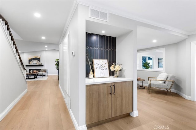 8093 Banyan St, Rancho Cucamonga, CA 91701 - corridor featuring light wood-style floors, crown molding, recessed lighting, and baseboards