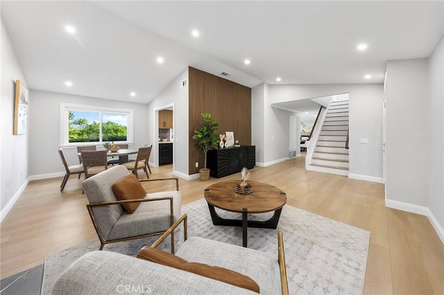8093 Banyan St, Rancho Cucamonga, CA 91701 - living area with stairs, baseboards, light wood-style floors, recessed lighting, and lofted ceiling