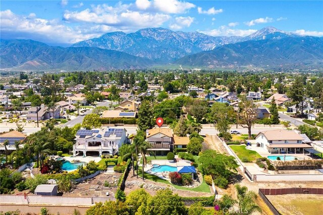 8093 Banyan St, Rancho Cucamonga, CA 91701 - aerial perspective of suburban area with a pool area and a mountainous background