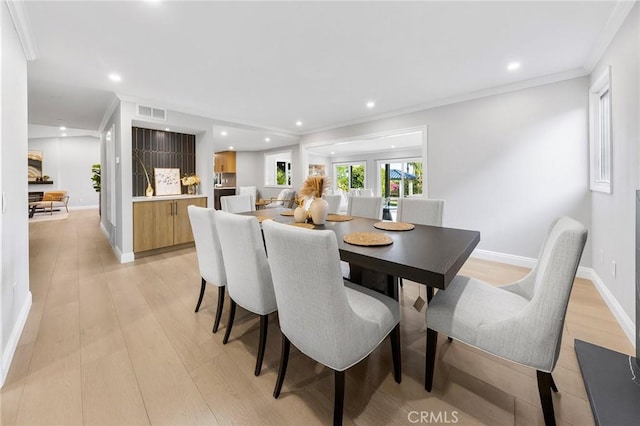 8093 Banyan St, Rancho Cucamonga, CA 91701 - dining space featuring baseboards, crown molding, light wood finished floors, and recessed lighting