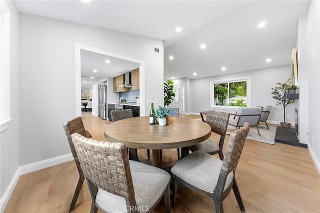 8093 Banyan St, Rancho Cucamonga, CA 91701 - dining room with light wood-style floors, baseboards, lofted ceiling, and recessed lighting