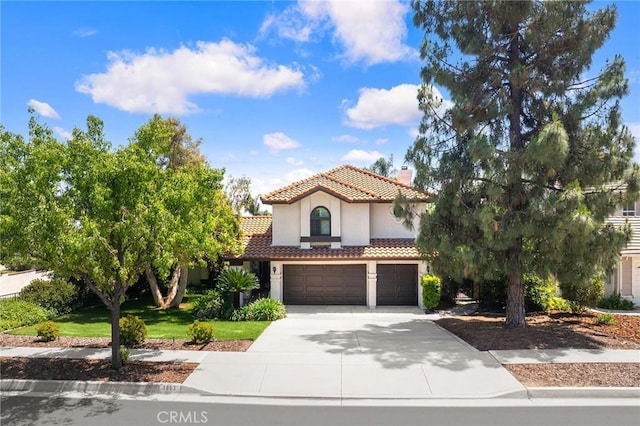8093 Banyan St, Rancho Cucamonga, CA 91701 - mediterranean / spanish-style home featuring a tile roof, an attached garage, a chimney, concrete driveway, and stucco siding