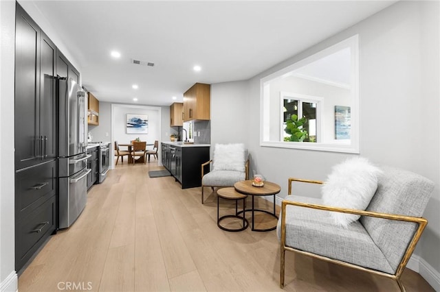 8093 Banyan St, Rancho Cucamonga, CA 91701 - kitchen featuring stainless steel appliances, light countertops, light wood-type flooring, a sink, and recessed lighting