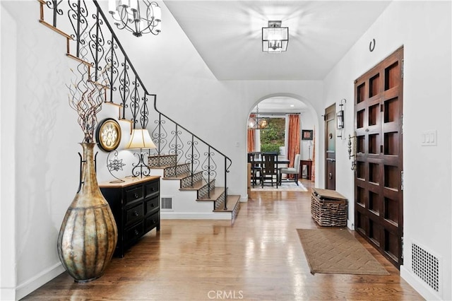 3101 San Gabriel Ave, Glendale, CA 91208 - entryway featuring stairway, wood finished floors, arched walkways, and baseboards