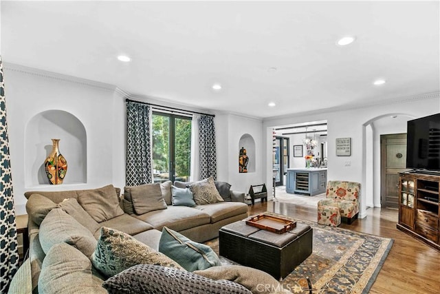 3101 San Gabriel Ave, Glendale, CA 91208 - living room featuring arched walkways, ornamental molding, recessed lighting, and light wood-type flooring