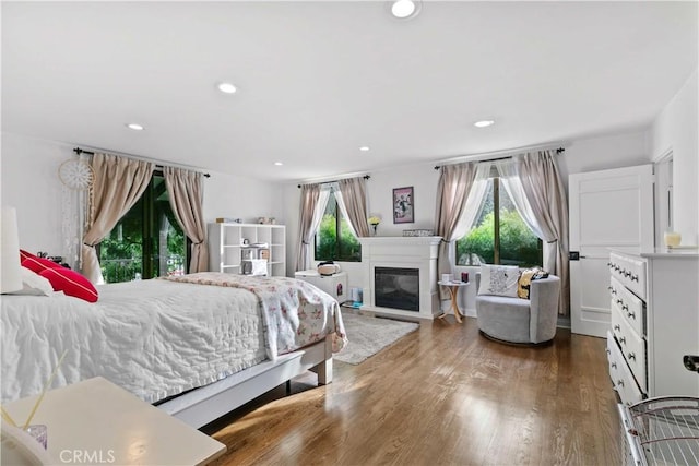 3101 San Gabriel Ave, Glendale, CA 91208 - bedroom featuring multiple windows, wood finished floors, recessed lighting, and a glass covered fireplace