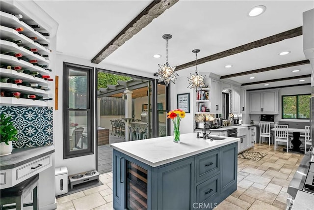 3101 San Gabriel Ave, Glendale, CA 91208 - kitchen featuring wine cooler, beam ceiling, open shelves, light stone finish floors, and light countertops