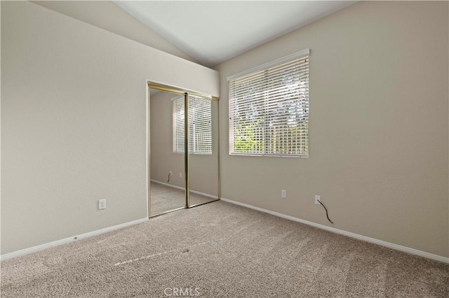 27523 Wellington Ct, Valencia, CA 91354 - unfurnished bedroom with carpet, lofted ceiling, a closet, and baseboards
