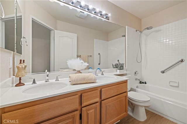27523 Wellington Ct, Valencia, CA 91354 - full bath with double vanity, shower / bath combination, toilet, and wood finished floors