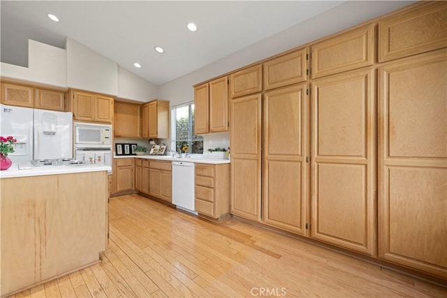 27523 Wellington Ct, Valencia, CA 91354 - kitchen featuring white appliances, light brown cabinets, light countertops, light wood-style flooring, and high vaulted ceiling