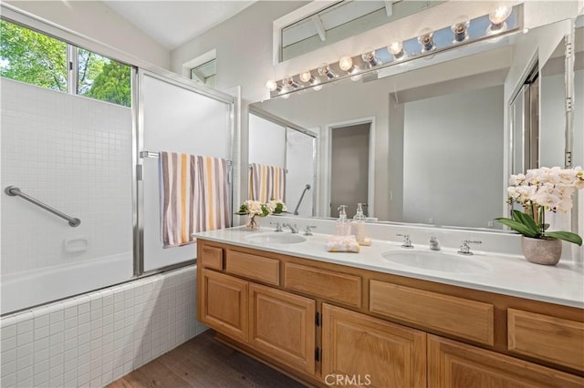 27523 Wellington Ct, Valencia, CA 91354 - full bath with double vanity, tiled shower / bath combo, and wood finished floors
