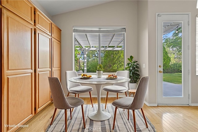 27523 Wellington Ct, Valencia, CA 91354 - dining area featuring light wood-style floors, lofted ceiling, and baseboards