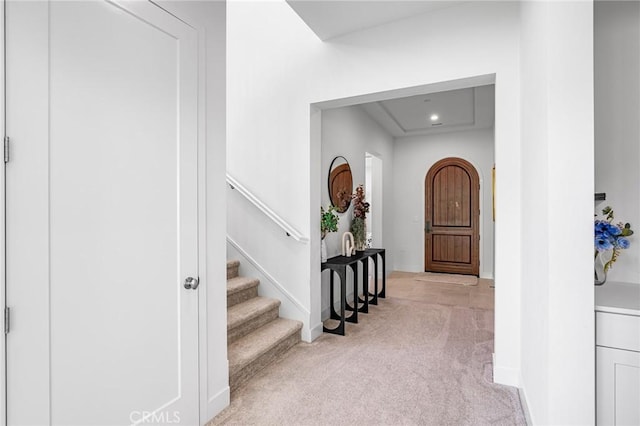 100 Bright Star, Irvine, CA 92618 - foyer entrance featuring light colored carpet, stairway, and baseboards