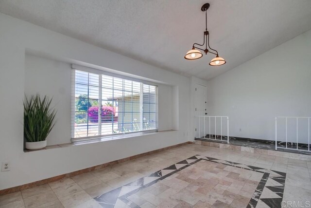 1695 Bubbling Well Dr, San Diego, CA 92154 - empty room featuring vaulted ceiling and baseboards