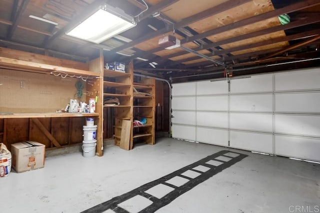 1695 Bubbling Well Dr, San Diego, CA 92154 - garage featuring a workshop area and a garage door opener