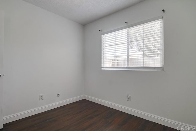 1695 Bubbling Well Dr, San Diego, CA 92154 - empty room featuring dark wood-style flooring, baseboards, and a textured ceiling