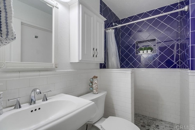 1695 Bubbling Well Dr, San Diego, CA 92154 - full bath featuring a sink, a tile shower, toilet, and tile walls