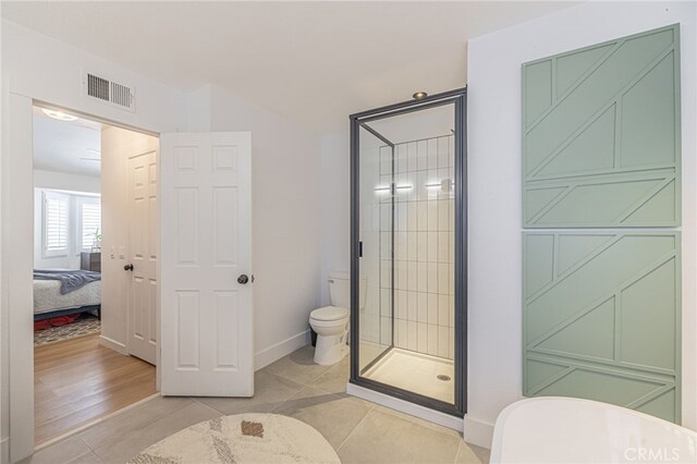 41438 Almond Ave, Palmdale, CA 93551 - ensuite bathroom featuring toilet, a stall shower, tile patterned floors, and baseboards