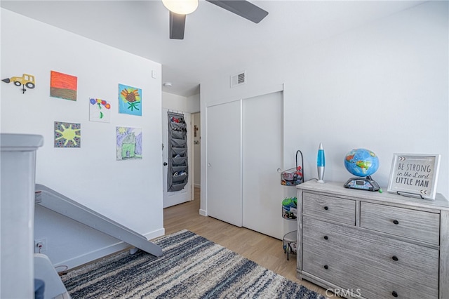 41438 Almond Ave, Palmdale, CA 93551 - bedroom with light wood finished floors, a closet, ceiling fan, and baseboards