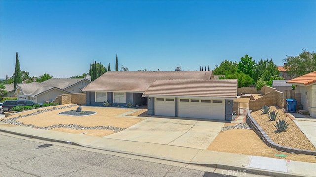 41438 Almond Ave, Palmdale, CA 93551 - ranch-style house featuring an attached garage, a tile roof, and concrete driveway