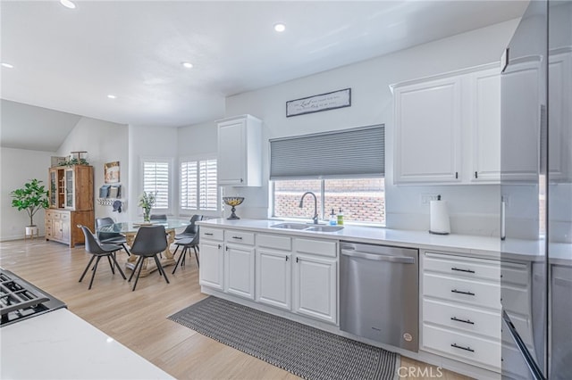 41438 Almond Ave, Palmdale, CA 93551 - kitchen featuring dishwasher, a sink, high end fridge, recessed lighting, and light wood-type flooring