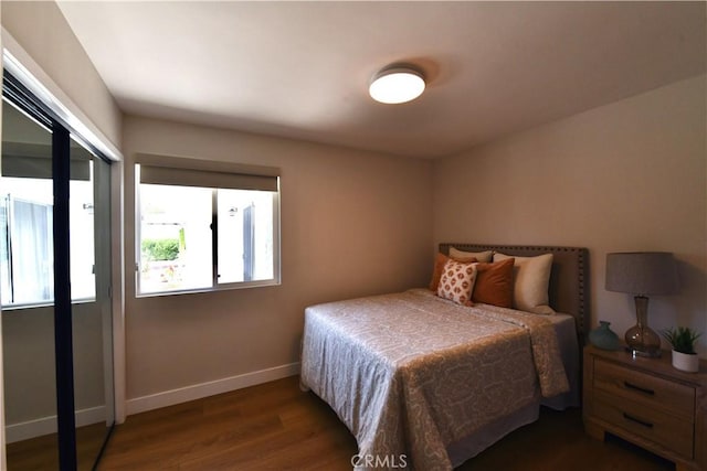 2821 Tucker Ln, Rossmoor, CA 90720 - bedroom with dark wood-style flooring and baseboards