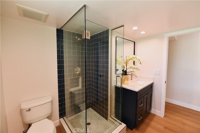 2821 Tucker Ln, Rossmoor, CA 90720 - full bath featuring toilet, a shower stall, wood finished floors, vanity, and recessed lighting
