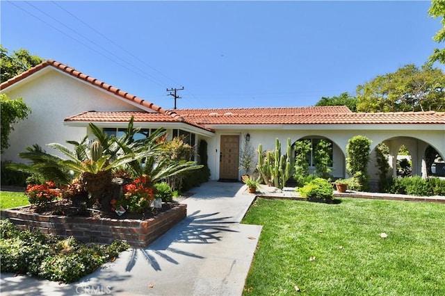 2821 Tucker Ln, Rossmoor, CA 90720 - view of front of house featuring a front lawn, stucco siding, and a tiled roof