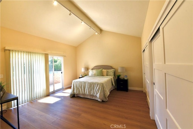 2821 Tucker Ln, Rossmoor, CA 90720 - bedroom featuring track lighting, access to exterior, wood finished floors, baseboards, and a closet