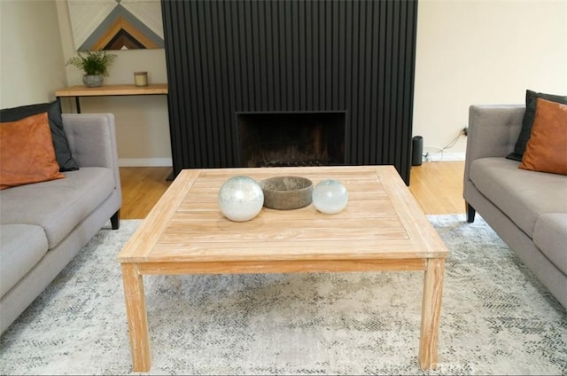 6702 E El Progreso St, Long Beach, CA 90815 - living room with wood finished floors, baseboards, and a fireplace