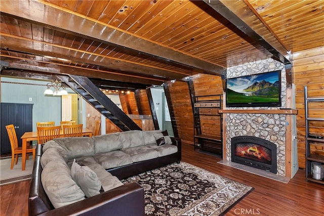 24091 Lakeview Dr, Crestline, CA 92325 - living room with wooden ceiling with exposed beams, wooden walls, stairs, hardwood / wood-style floors, and a fireplace