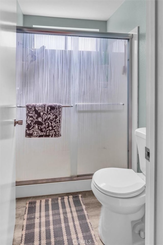 26834 Pinckney Way, Menifee, CA 92586 - full bathroom with toilet, plenty of natural light, and wood finished floors