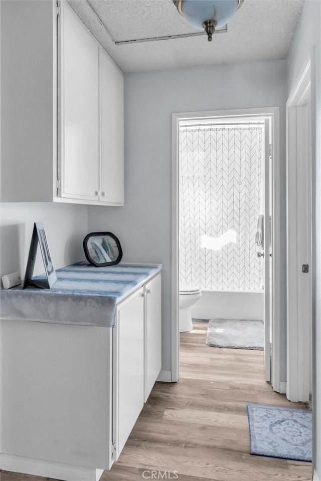 26834 Pinckney Way, Menifee, CA 92586 - laundry room featuring light wood-type flooring