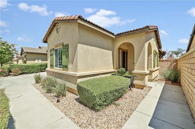 26344 Leos Trl, Menifee, CA 92586 - view of front of home with stucco siding and a tiled roof