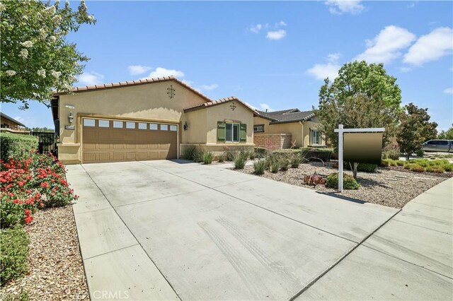26344 Leos Trl, Menifee, CA 92586 - mediterranean / spanish home featuring stucco siding, concrete driveway, a garage, and a tile roof