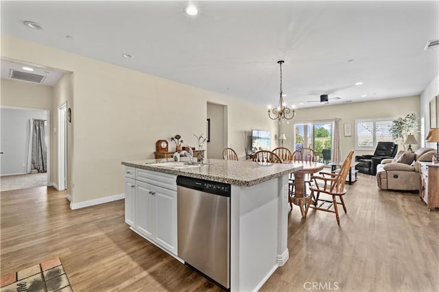 26344 Leos Trl, Menifee, CA 92586 - kitchen featuring stainless steel dishwasher, open floor plan, light wood-style flooring, recessed lighting, and an island with sink