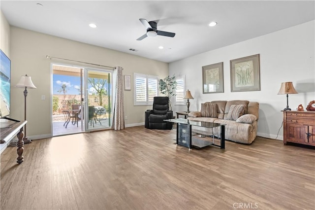 26344 Leos Trl, Menifee, CA 92586 - living area featuring wood finished floors, ceiling fan, and recessed lighting