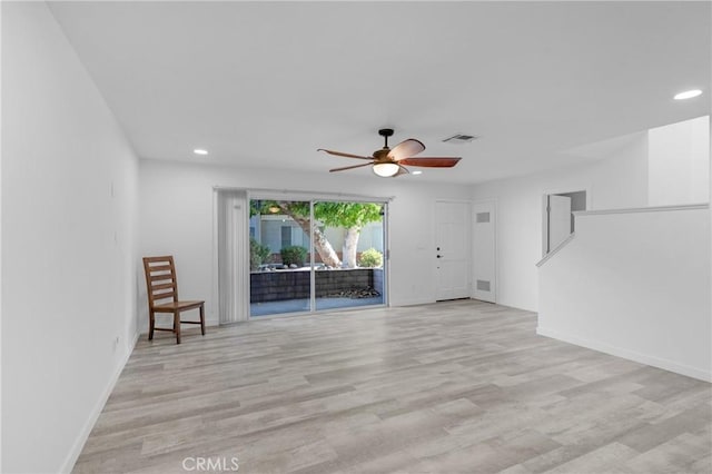 31864 Railroad Canyon Rd Unit 6 D, Canyon Lake, CA 92587 - unfurnished living room with recessed lighting, baseboards, and light wood-style floors