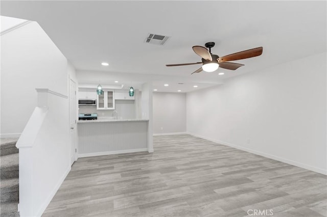31864 Railroad Canyon Rd Unit 6 D, Canyon Lake, CA 92587 - unfurnished living room with a ceiling fan, recessed lighting, light wood finished floors, and baseboards